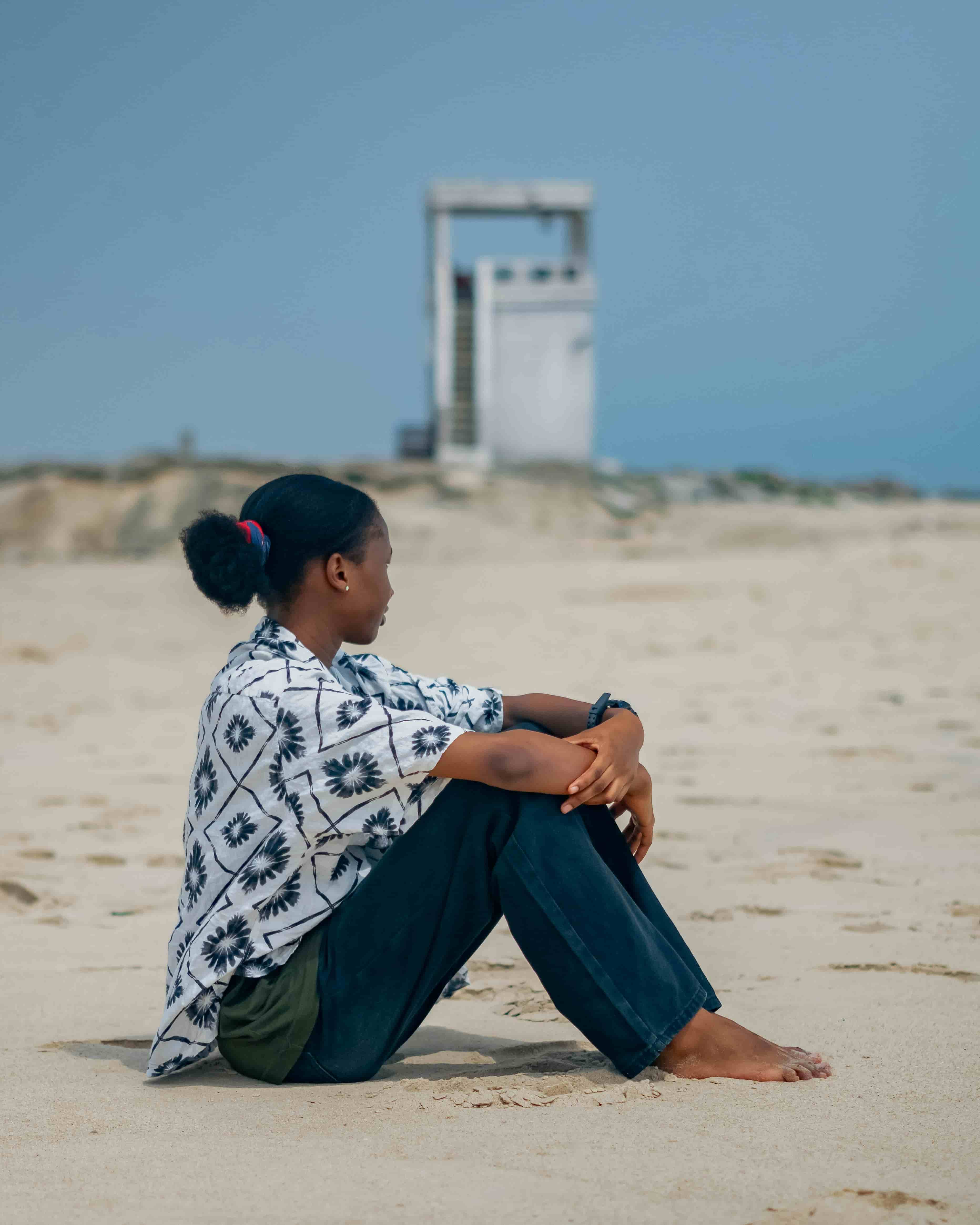 Professional in quiet reflection by the ocean